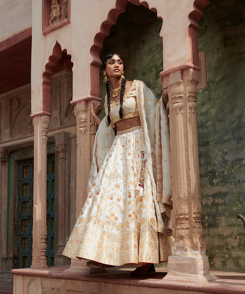 Handloom_White_Mughal_Jaal_Pure_Katan_Silk_Banarasi_lehenga_with_Gotta_work_Zardozi_Dupatta_and_Blouse_WeaverStory_01