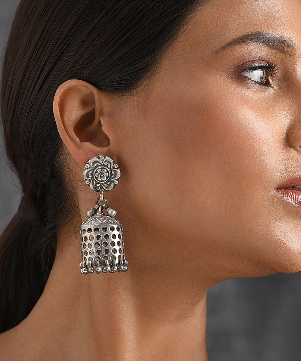 A captivating combination of one pair of oxidized jhumki earrings and  yellow designer earrings, blending traditional