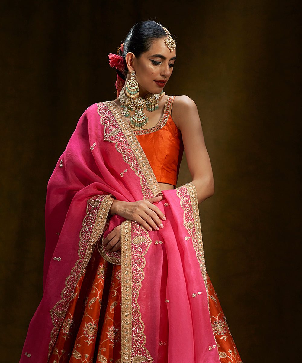 Orange_Handloom_Banarasi_Lehenga_with_Pink_Mughal_Zardozi_Dupatta_WeaverStory_01