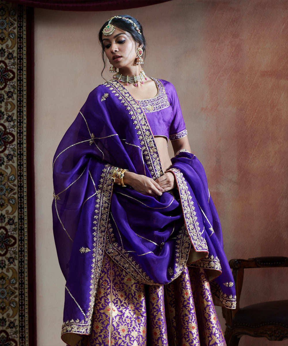 Handloom Purple Hand Embroidered Pure Katan Silk Banarasi Bageecha Lehenga With Blouse And Organza
