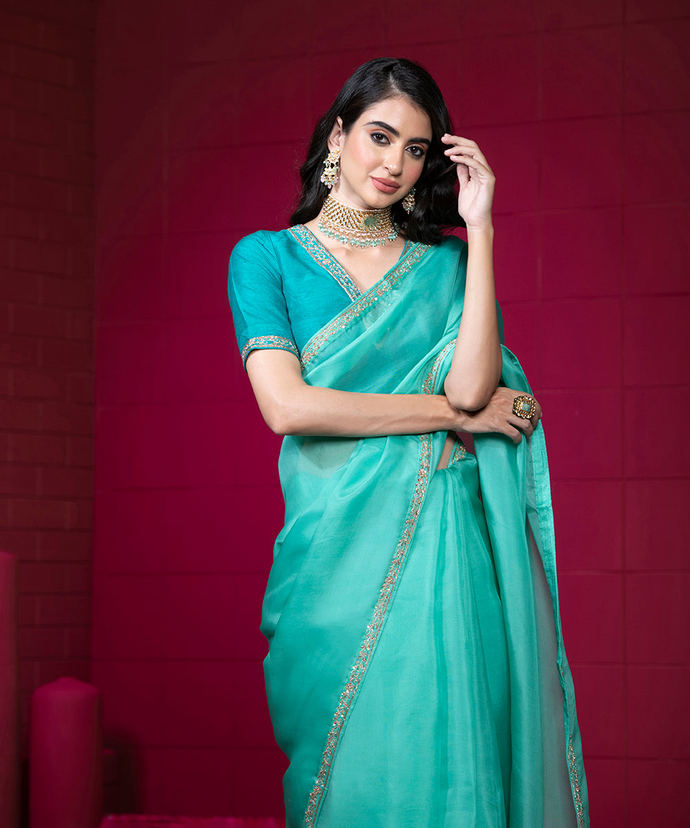 Handloom_Aqua_Blue_Organza_Saree_with_Embroidered_Motifs_And_Sea_Green_Raw_Silk_Blouse_WeaverStory_01