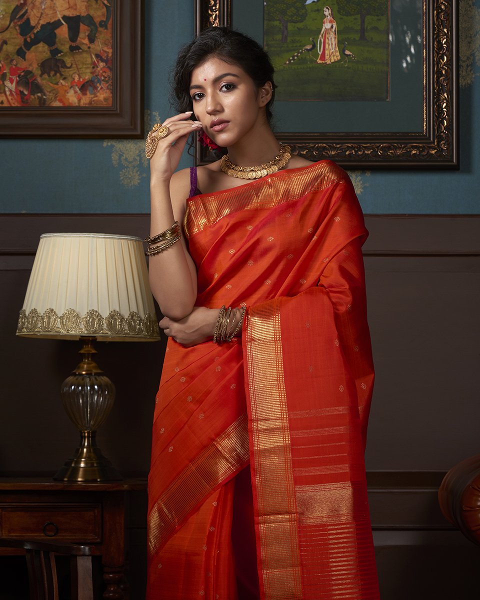 Orange_Handloom_Pure_Silk_Kanjivaram_Saree_with_Gold_Zari_Motifs_WeaverStory_01