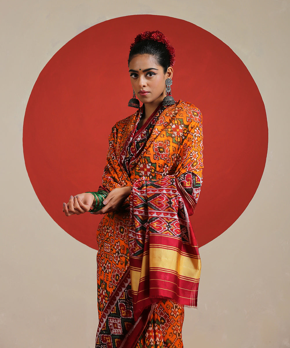 Handloom_Orange_Pure_Mulberry_Silk_Ikat_Patola_Saree_With_Twill_Weave_WeaverStory_01