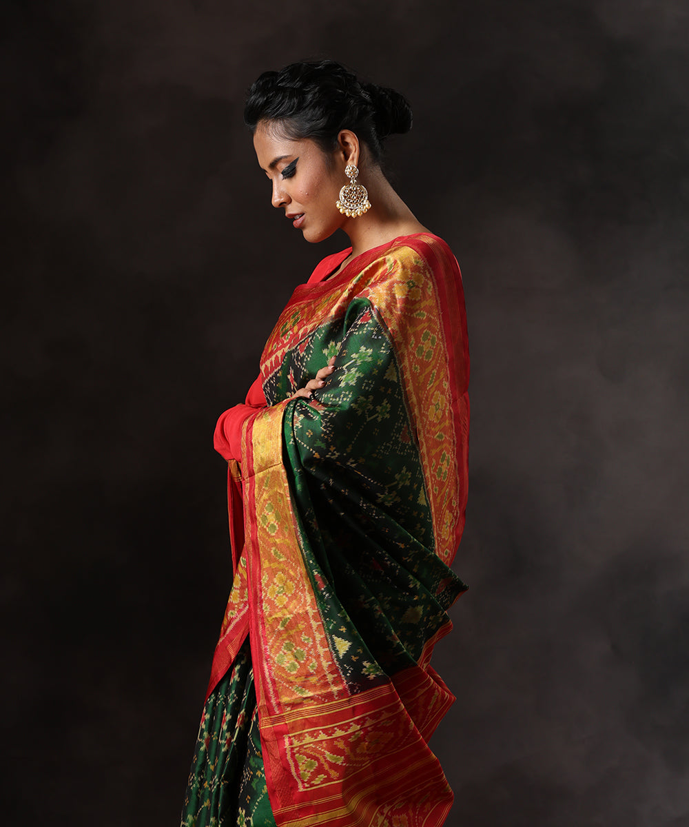 Green_Handloom_Pure_Mulberry_Silk_Single_Ikat_Patola_Saree_With_Red_Tissue_Border_WeaverStory_01