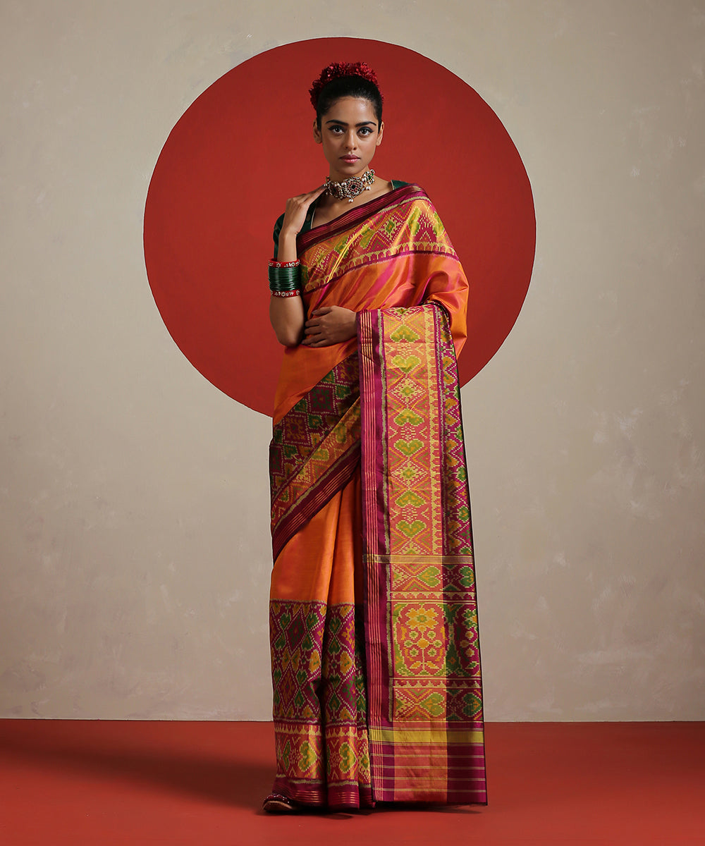 Peach_Handloom_Pure_Mulberry_Silk_Ikat_Patola_Saree_With_Purple_Tissue_Border_WeaverStory_02