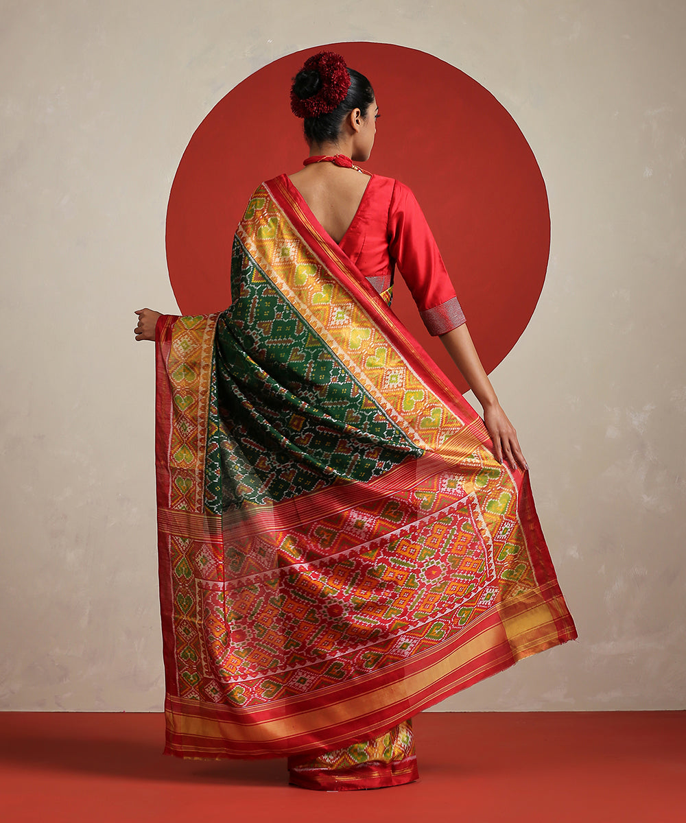 Green_Handloom_Pure_Mulberry_Silk_Patola_With_Red_Tissue_Border_Saree_WeaverStory_03
