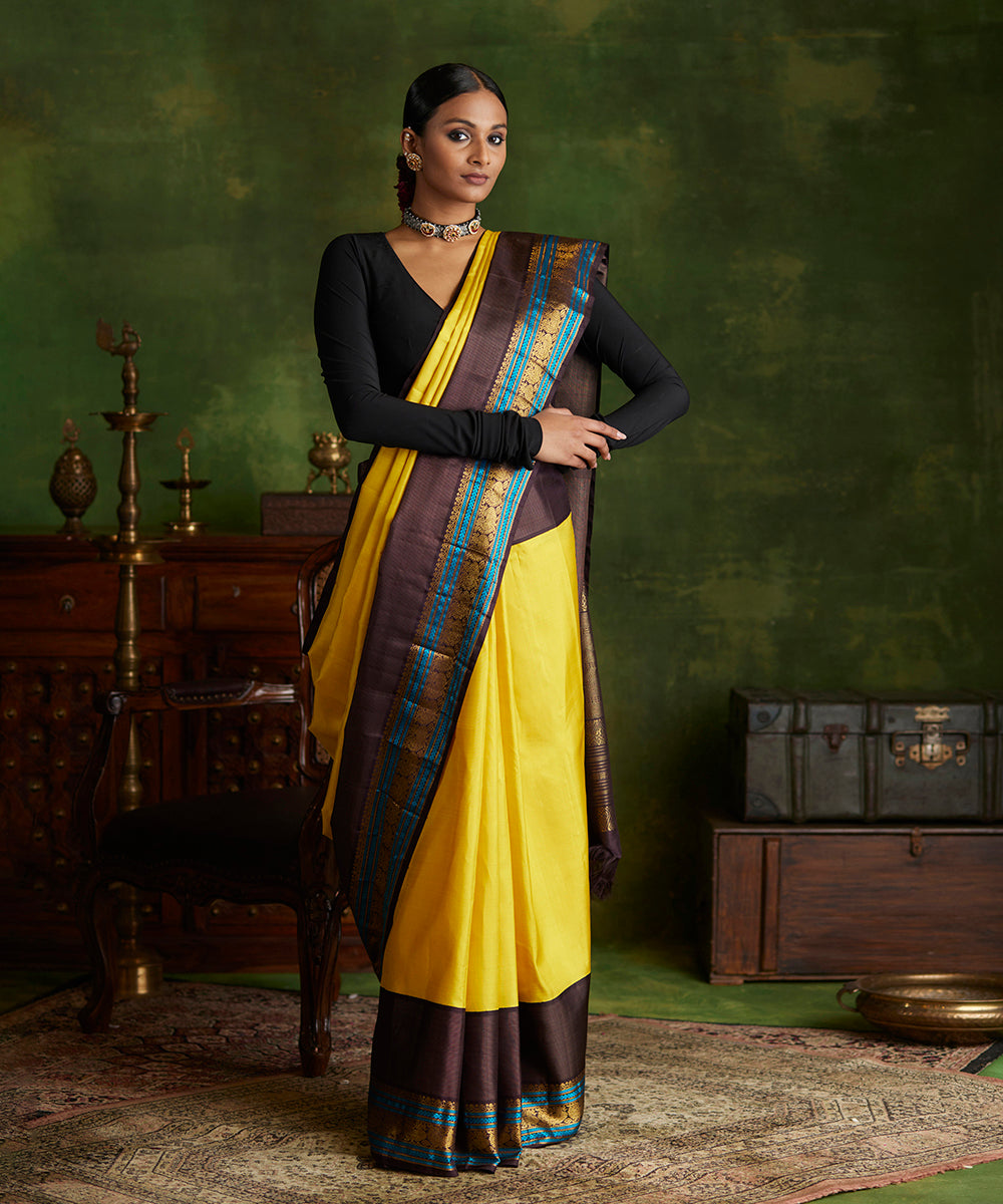 Handloom_Yellow_Pure_Silk_Kanjivaram_Saree_With_Korvai_Black_Border_WeaverStory_02