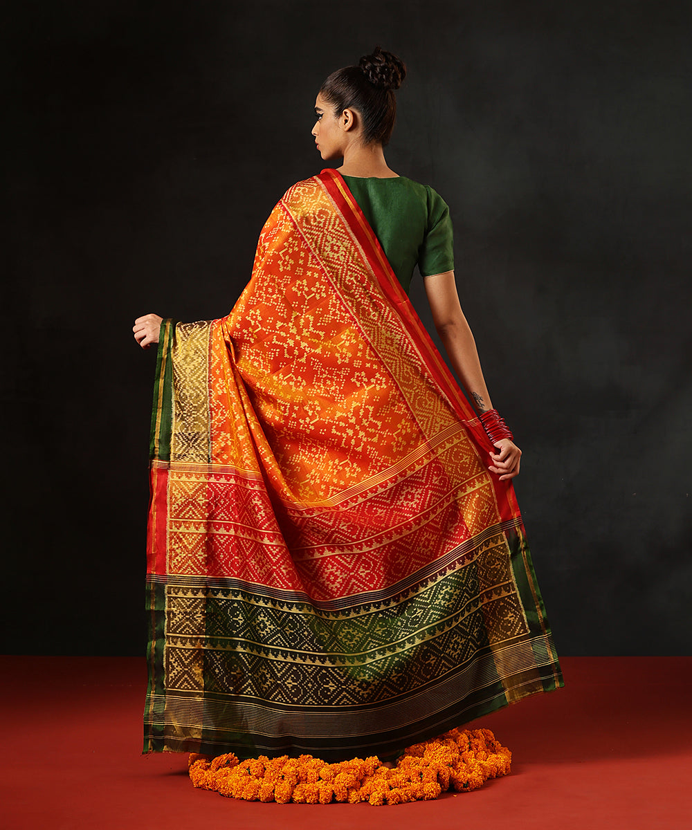 Handloom_Orange_Double_Shade_Pure_Mulberry_Silk_Single_Ikat_Patola_Saree_WithGreen_Pallu_And_Tissue_Border_WeaverStory_03