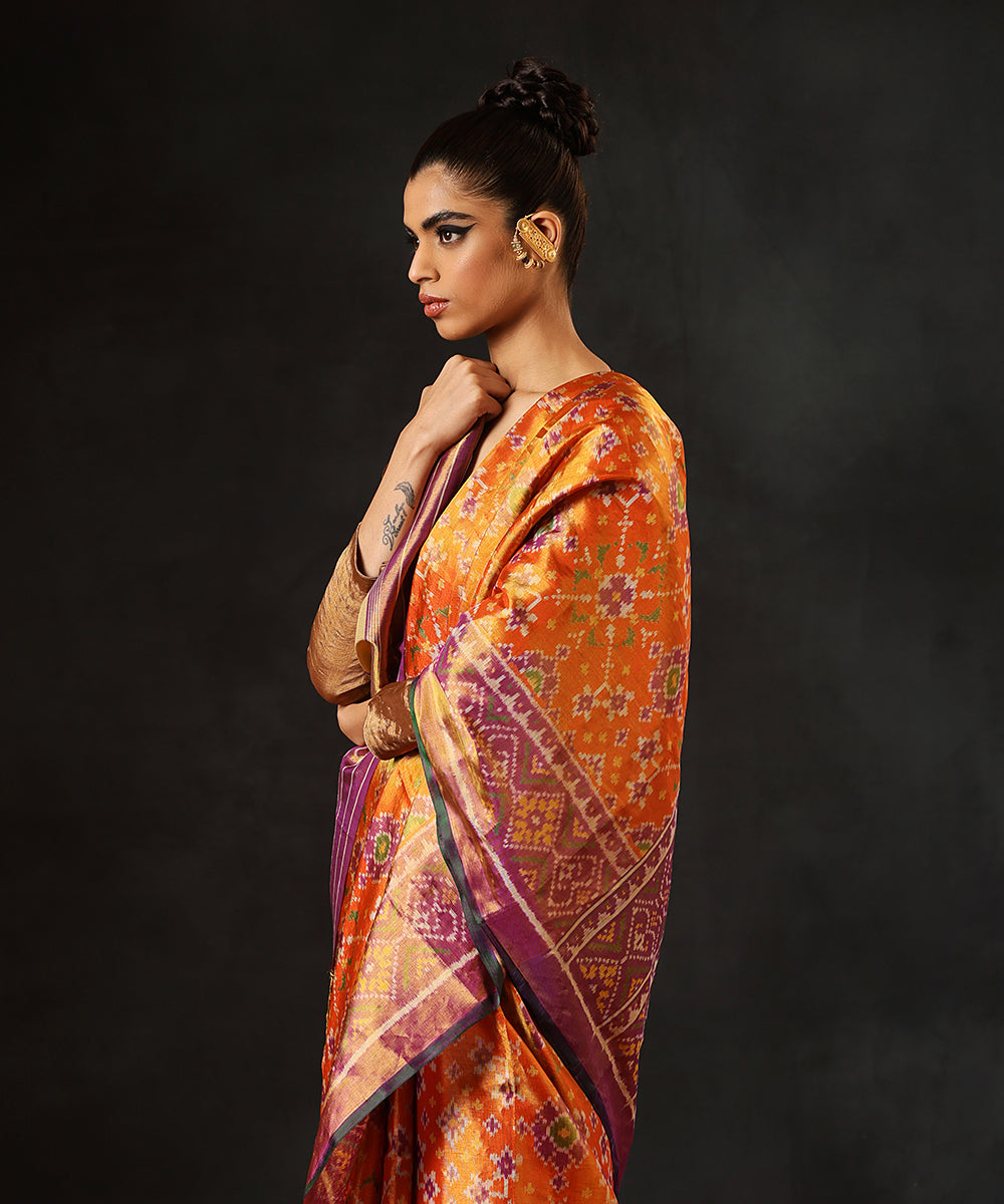 Handloom_Orange_And_Lavender_Tissue_Silk_Single_Ikat_Patola_Saree_With_Green_Selvedge_WeaverStory_01