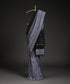 Grey_And_Black_Handloom_Cotton_Silk_Ikat_Saree_With_All_Over_Strings_Of_Music_Design_WeaverStory_01