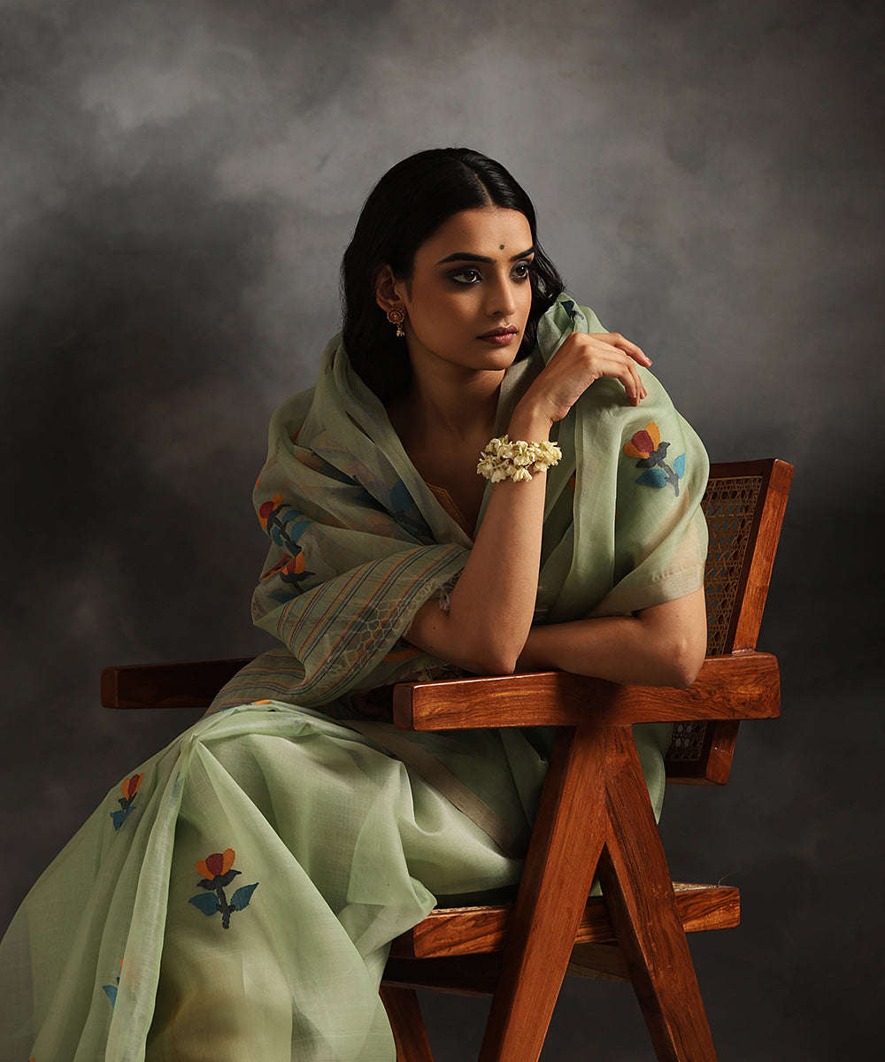 Pistachio_Green_Handloom_Pure_Kora_Silk_Muslin_Dhakai_Jamdani_Saree_With_Blue_Leaves_WeaverStory_01