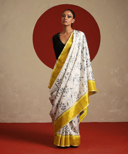 Handloom_Offwhite_And_Yellow_Pure_Mulberry_Silk_Single_Ikat_Patola_Saree_WeaverStory_02