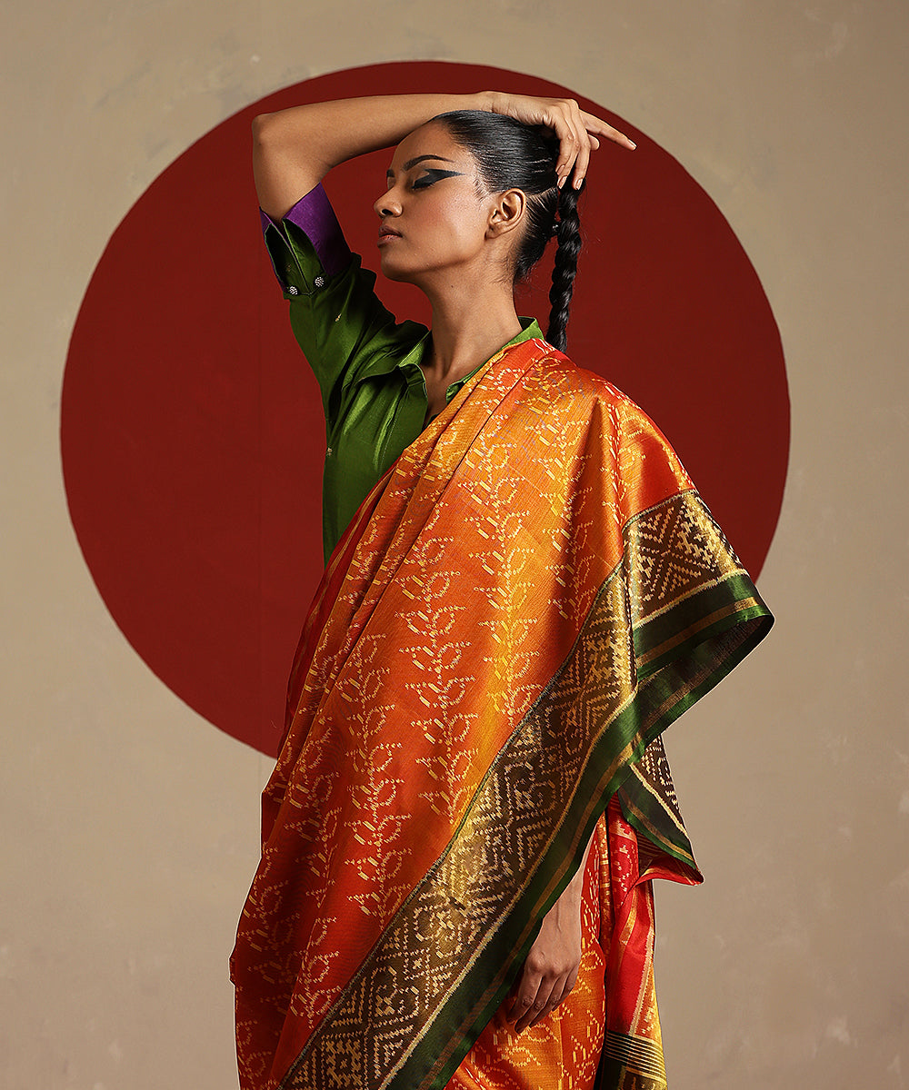 Handloom_Orange_And_Green_Double_Shade_Pure_Mulberry_Silk_Ikat_Patola_Saree_WeaverStory_01