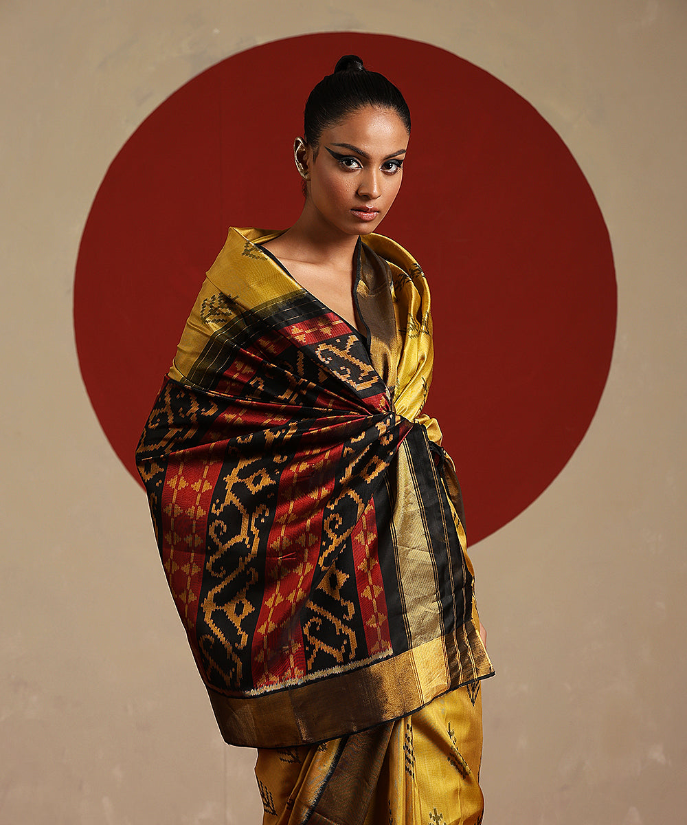 Handloom_Black_And_Gold_Pure_Mulberry_Silk_Ikat_Patola_Saree_With_Tissue_Border_WeaverStory_01
