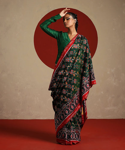 Green_And_Maroon_Handloom_Pure_Mulberry_Silk_Ikat_Patola_Saree_WeaverStory_02