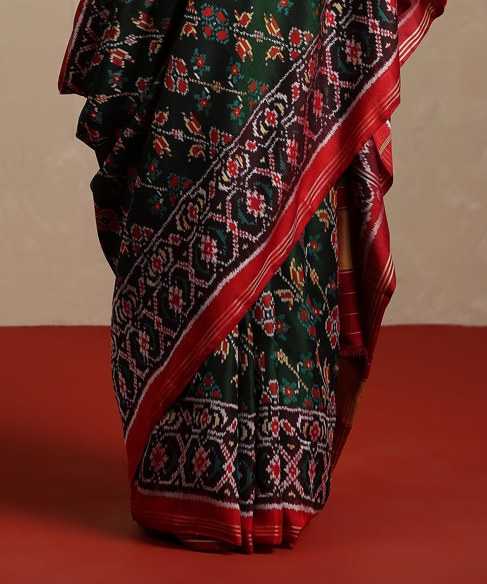 Green_And_Maroon_Handloom_Pure_Mulberry_Silk_Ikat_Patola_Saree_WeaverStory_04