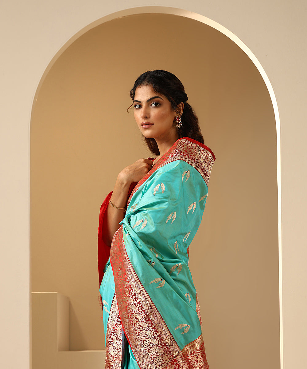 Aqua_Handloom_Pure_Katan_Silk_Banarasi_Saree_With_Red_Shikargah_Border_WeaverStory_01