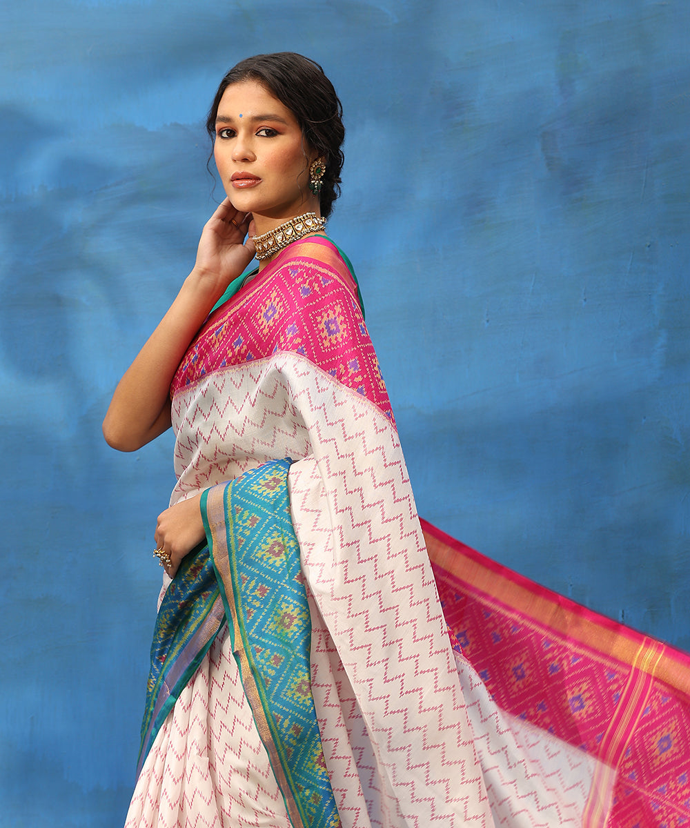 Handloom_White_And_Magenta_Pure_Mulberry_Silk_Ikat_Patola_Saree_With_Zari_Border_WeaverStory_02