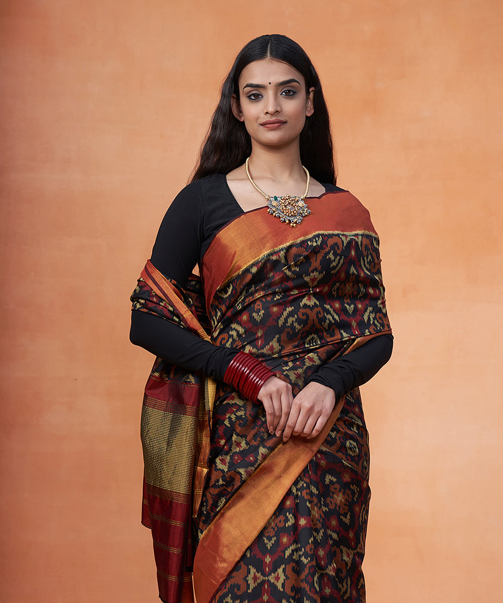 Handloom_Black_And_Maroon_Pure_Mulberry_Silk_Ikat_Patola_Saree_With_Zari_Border_WeaverStory_01