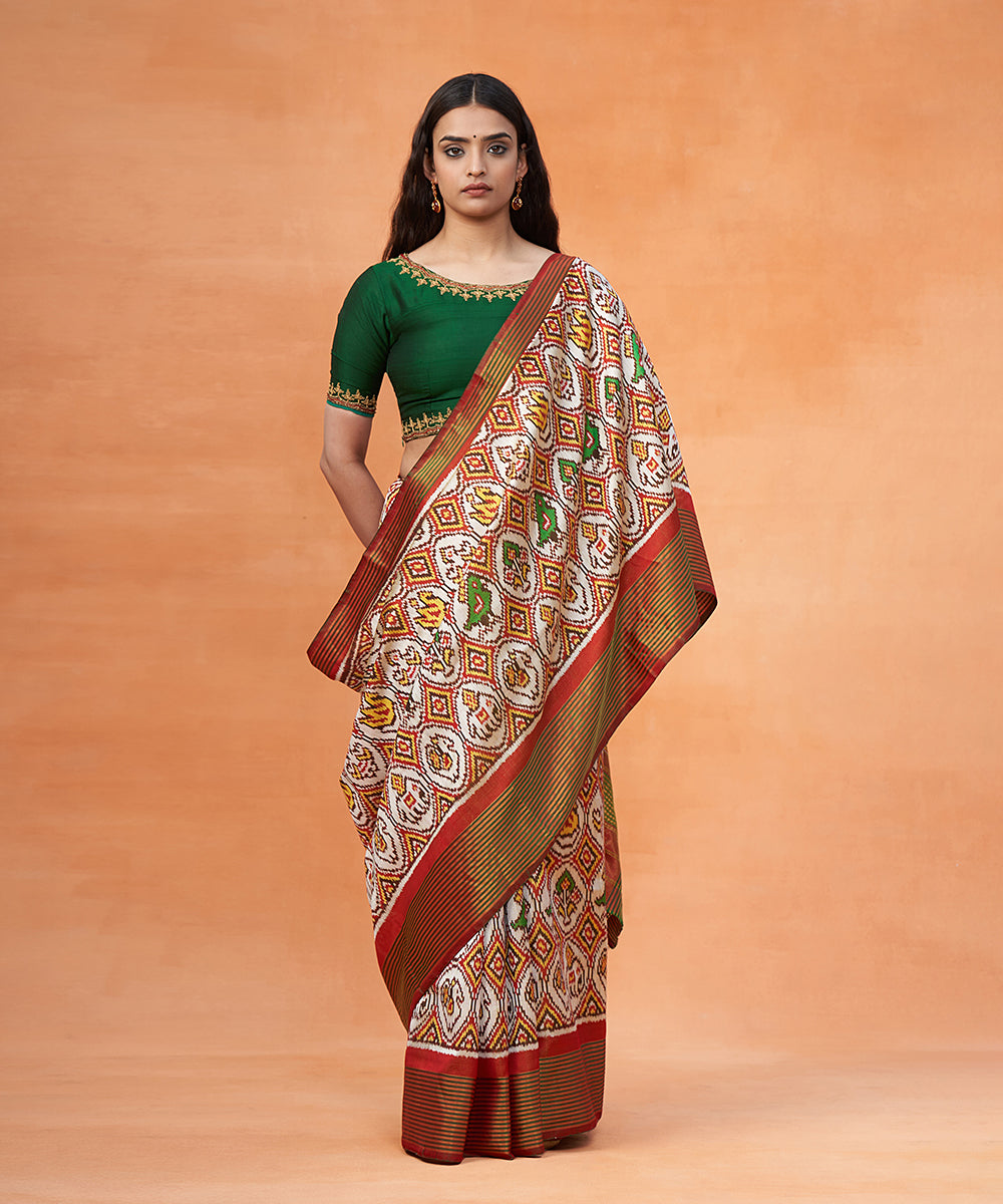 Bottle_Green_And_White_Pure_Mulberry_Silk_Ikat_Patola_Saree_With_Red_Border_WeaverStory_02