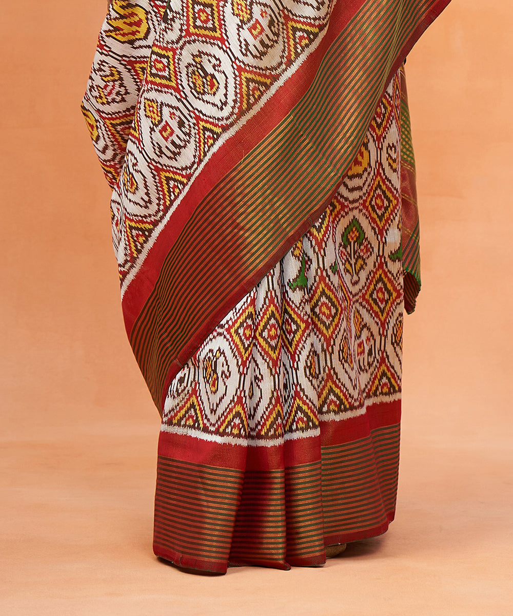 Bottle_Green_And_White_Pure_Mulberry_Silk_Ikat_Patola_Saree_With_Red_Border_WeaverStory_04