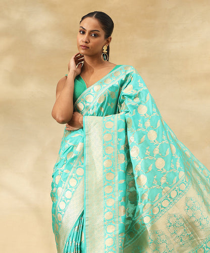 Handloom_Turquoise_Blue_Pure_Katan_Silk_Banarasi_Saree_With_All_Over_Floral_Zari_Jaal_WeaverStory_01