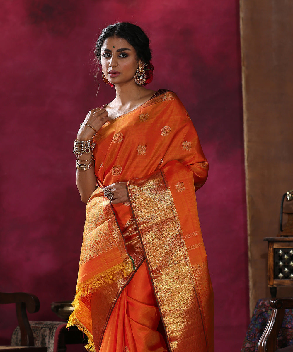 Handloom_Orange_Pure_Silk_Kanjivaram_Saree_with_Broad_Gold_Zari_Border_WeaverStory_01