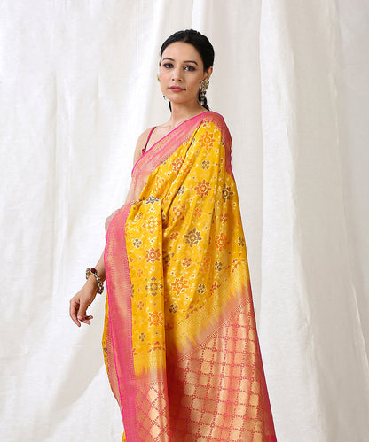 Yellow_Handloom_Pure_Katan_Silk_Banarasi_Patola_Saree_With_Pink_Border_WeaverStory_01