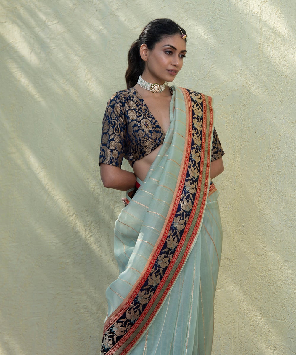 Handloom_Light_Green_Kora_Silk_Banarasi_Saree_With_Kadhwa_Zari_Stripes_And_Rose_Border_WeaverStory_01