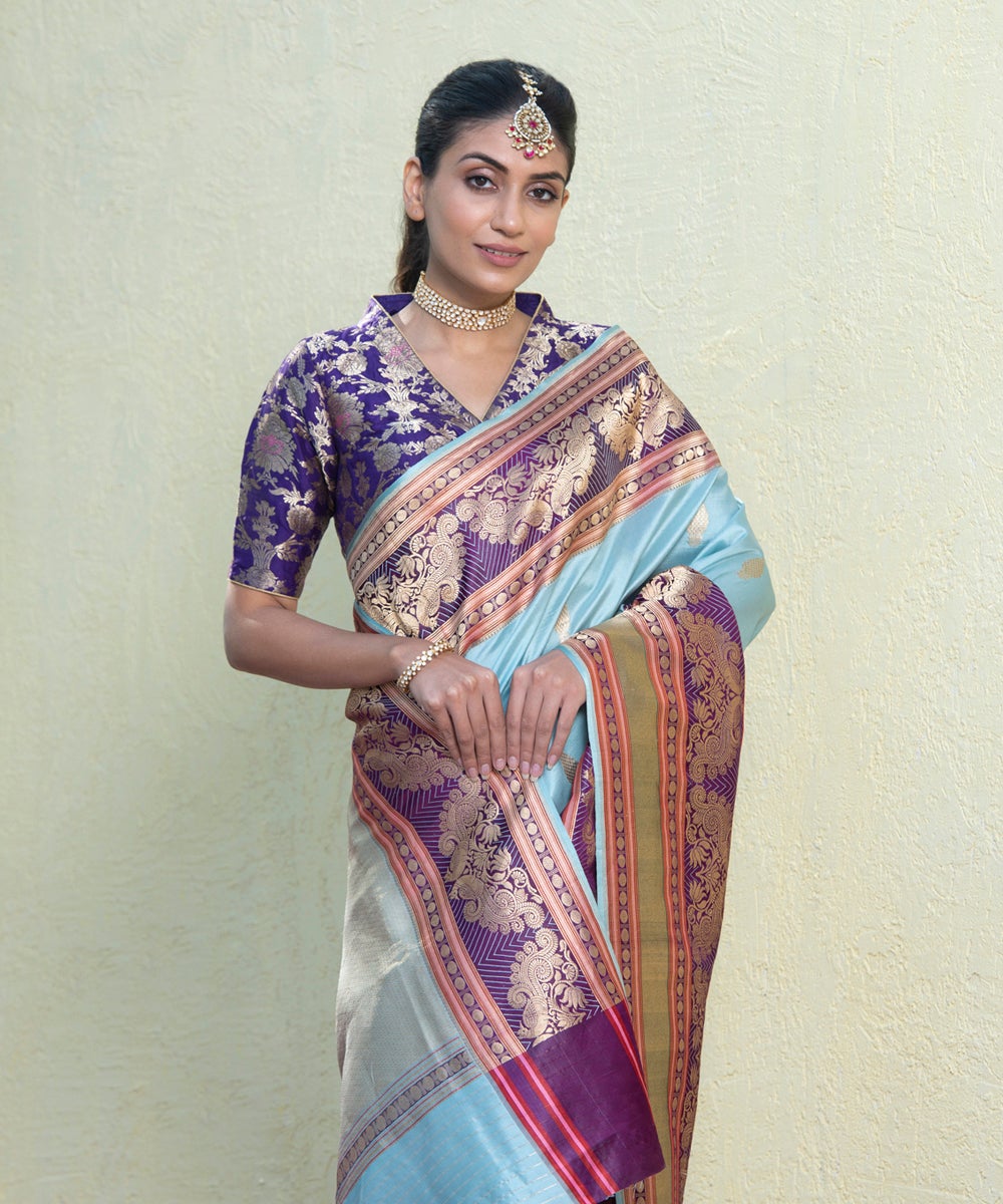 Handloom_Powder_Blue_Pure_Katan_Silk_Banarasi_Saree_with_Kadhwa_Booti_and_Purple_Border_With_Peacocks_WeaverStory_01