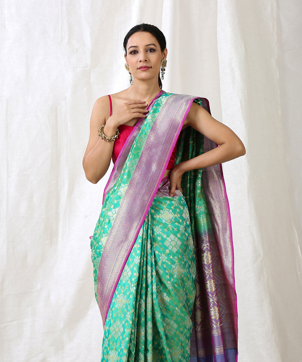 Aqua_Green_Handloom_Pure_Katan_Silk_Banarasi_Patola_Saree_with_Purple_Border_WeaverStory_01