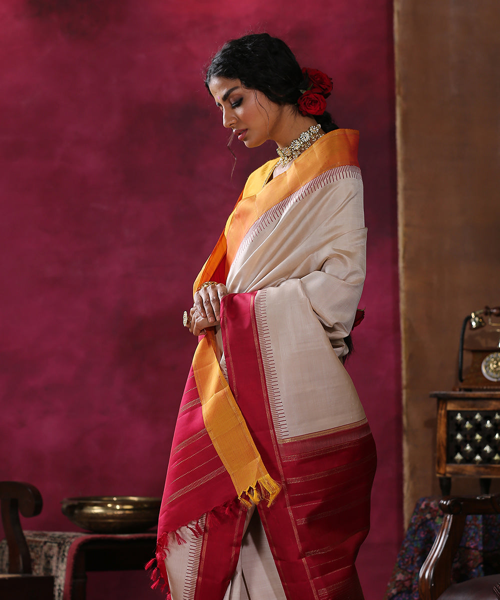 Handloom_Cream_Plain_Pure_Silk_Kanjivaram_Saree_With_Red_And_Mustard_Ganga_Jamuna_Border_WeaverStory_01