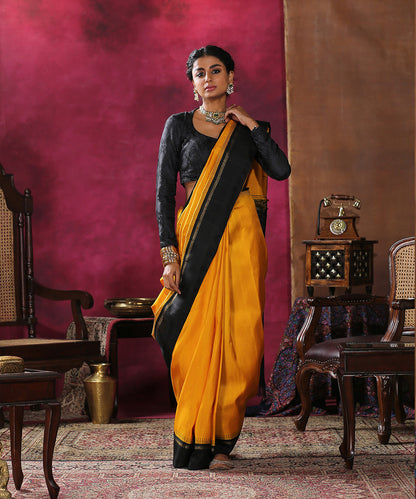 Handloom_Mustard_Plain_Pure_Silk_Kanjivaram_Saree_With_Black_Border_WeaverStory_02