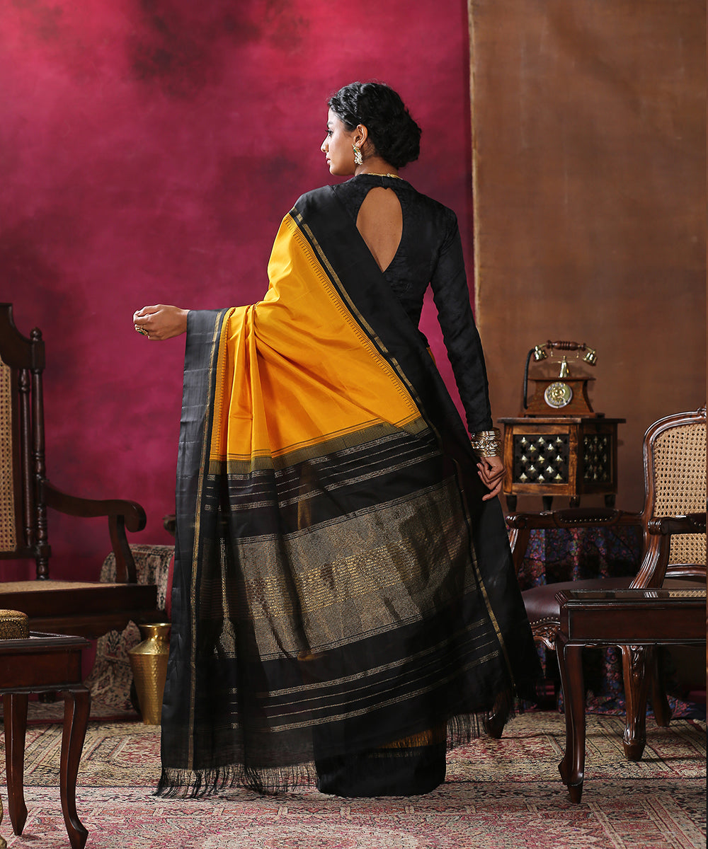 Handloom_Mustard_Plain_Pure_Silk_Kanjivaram_Saree_With_Black_Border_WeaverStory_03