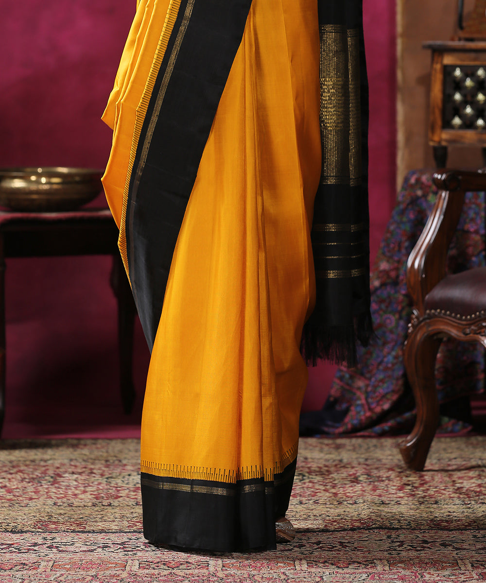 Handloom_Mustard_Plain_Pure_Silk_Kanjivaram_Saree_With_Black_Border_WeaverStory_04