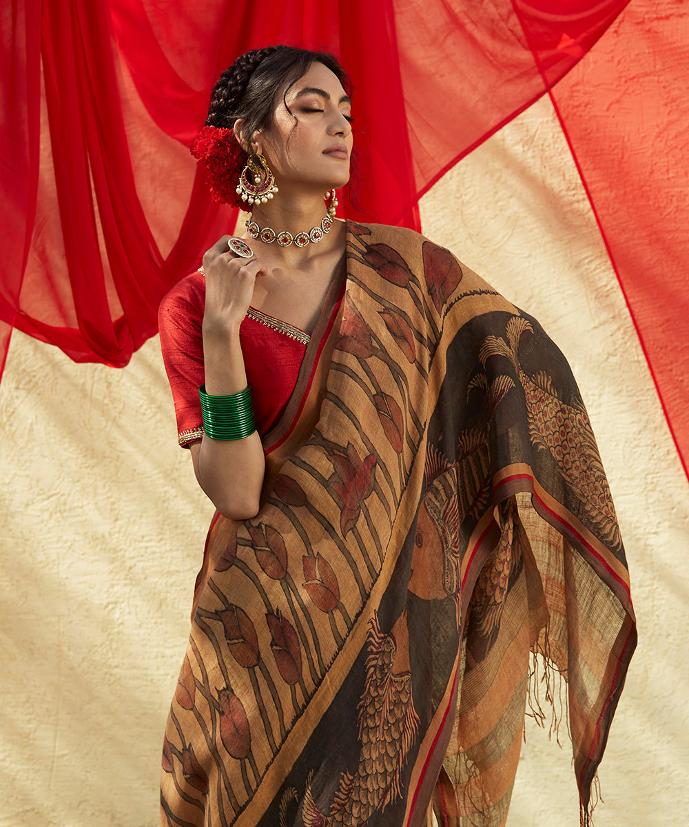 Brown_Handloom_Pure_Linen_Saree_With_Hand_Painted_Kalamkari_And_Lotus_Flowers_And_Fishes_Drawn_On_Border_WeaverStory_01