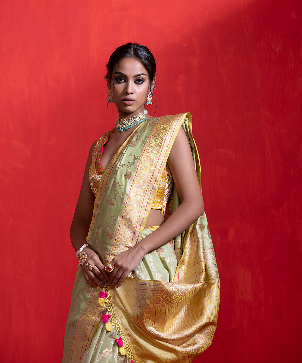 Pista_Green_Handloom_Pure_Katan_Silk_Banarasi_Saree_With_Meenakari_And_Kadhiyal_Yellow_Border_WeaverStory_01
