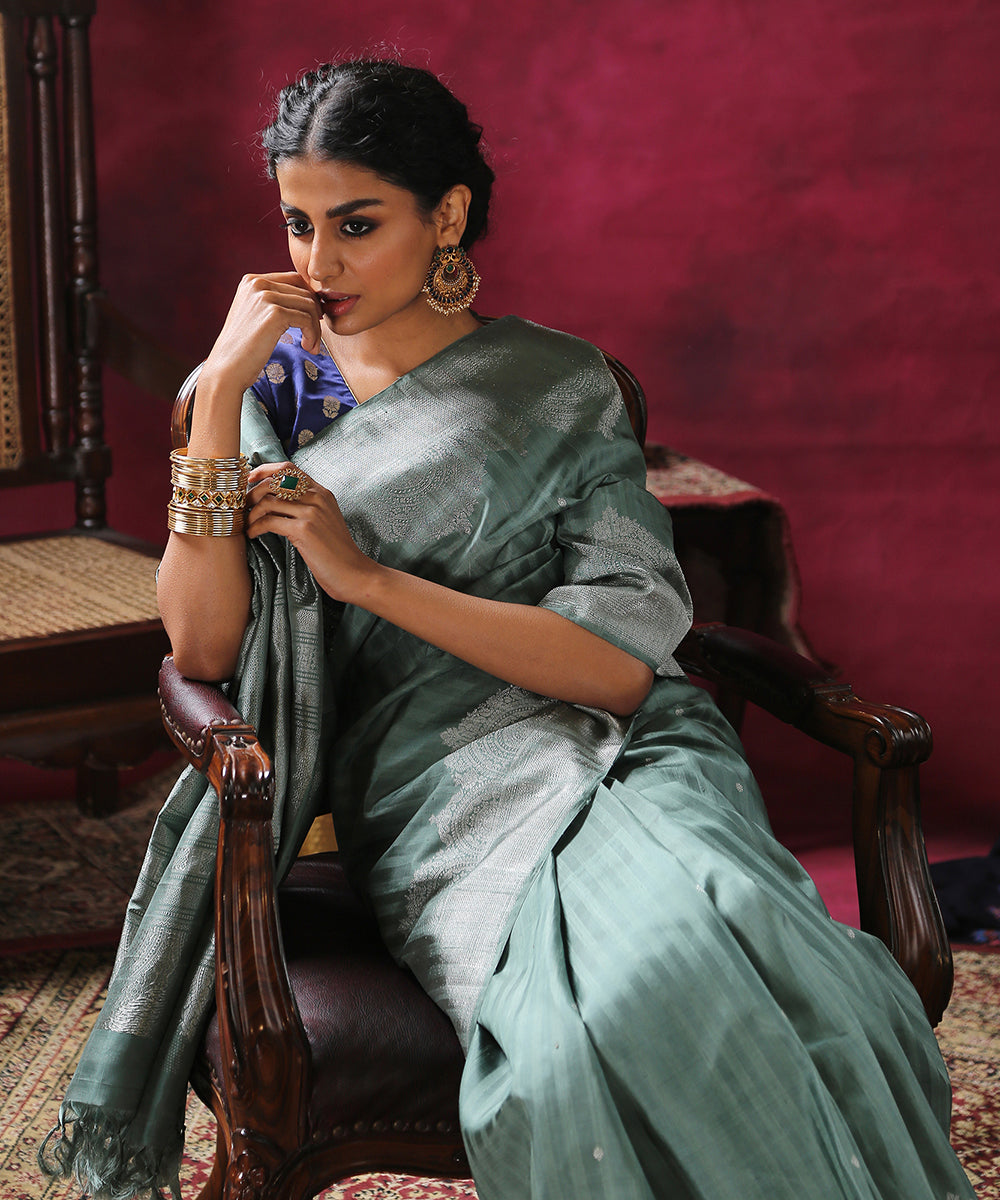 Sage_Green_Handloom_Pure_Silk_Kanjivaram_Saree_With_Silver_Zari_Arched_Border_WeaverStory_01
