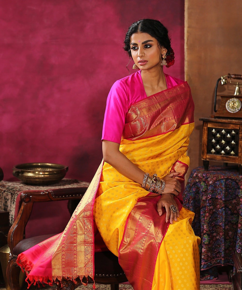 Handloom_Yellow_Pure_Silk_Kanjivaram_Saree_With_Pink_And_Gold_Broad_Borders_WeaverStory_01