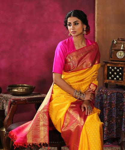 Handloom_Yellow_Pure_Silk_Kanjivaram_Saree_With_Pink_And_Gold_Broad_Borders_WeaverStory_01