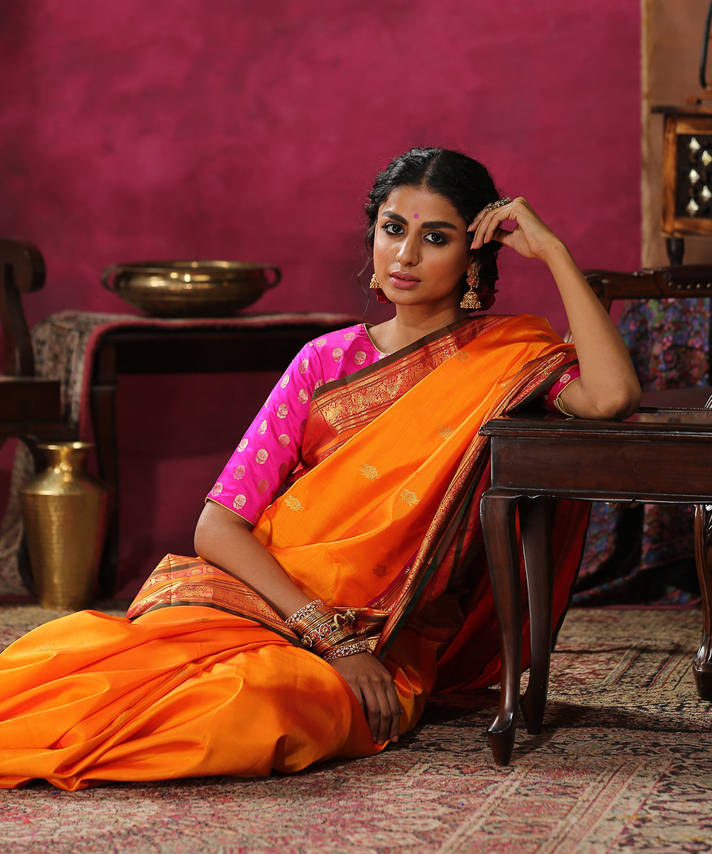 Handloom_Orange_Pure_Silk_Kanjivaram_Saree_With_Pink_And_Green_Border_WeaverStory_01