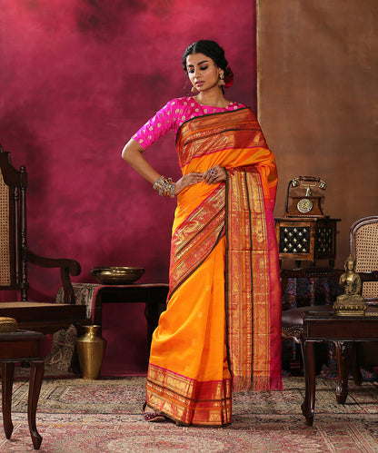 Handloom_Orange_Pure_Silk_Kanjivaram_Saree_With_Pink_And_Green_Border_WeaverStory_02