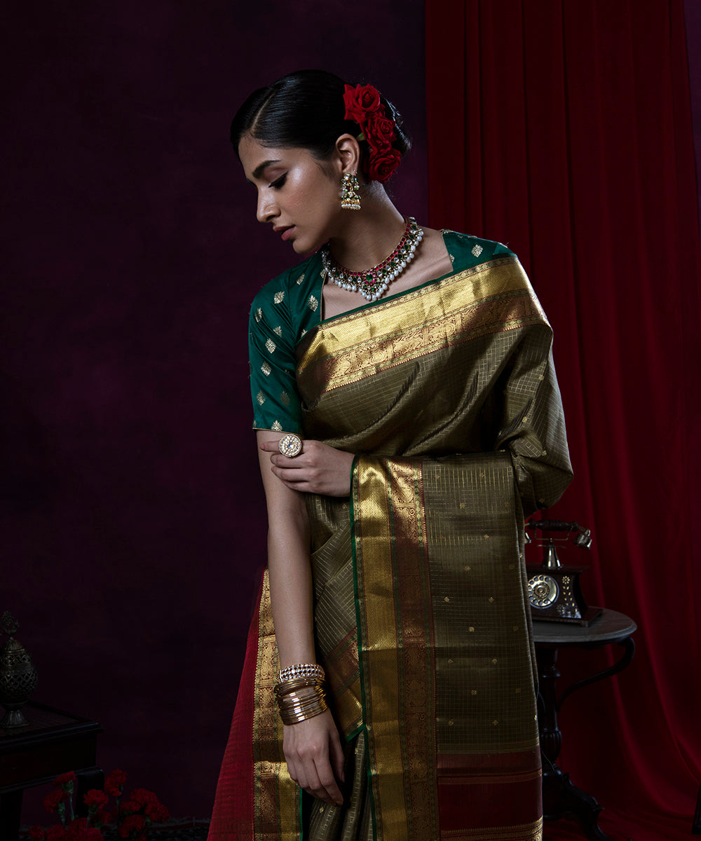 Olive_Green_Handloom_Pure_Zari_and_Silk_Kanjivaram_Saree_With_Annapakshi_Border_WeaverStory_01