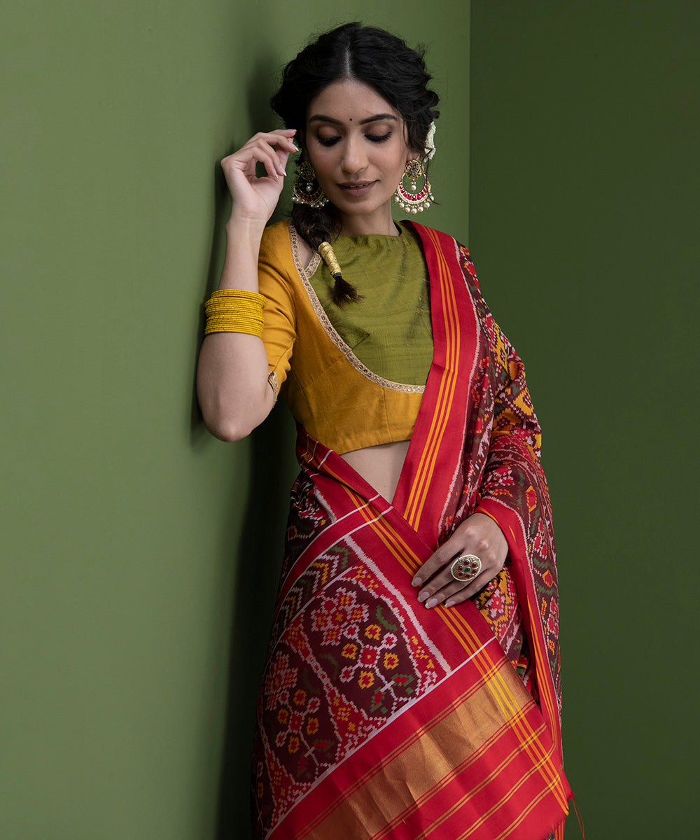 Handloom_Mustard_And_Red_Single_Ikat_Weft_Dyed_8_Ply_Mulberry_Silk_Patola_Saree_WeaverStory_01