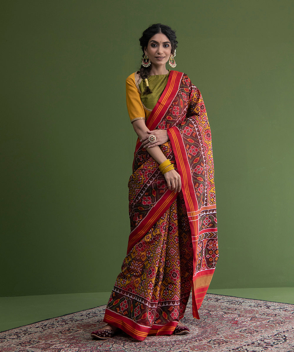 Handloom_Mustard_And_Red_Single_Ikat_Weft_Dyed_8_Ply_Mulberry_Silk_Patola_Saree_WeaverStory_02