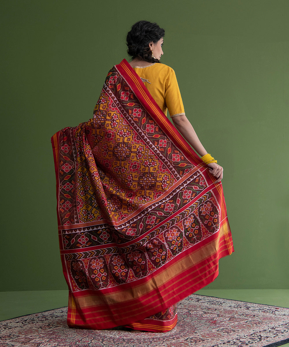 Handloom_Mustard_And_Red_Single_Ikat_Weft_Dyed_8_Ply_Mulberry_Silk_Patola_Saree_WeaverStory_03