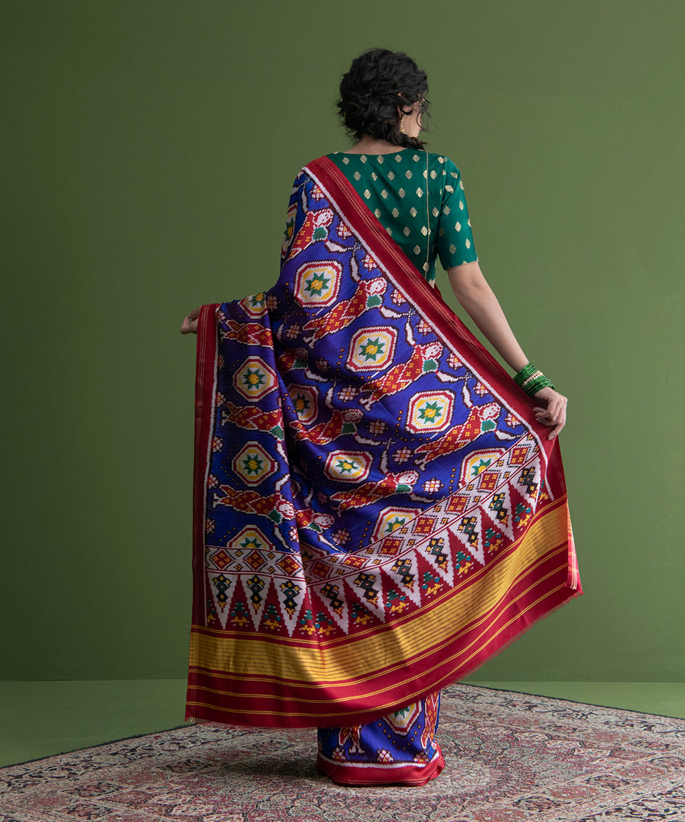 Blue_Weft_Dyed_Handloom_Patola_Saree_With_Red_Border_And_Village_Woman_Motifs_WeaverStory_03