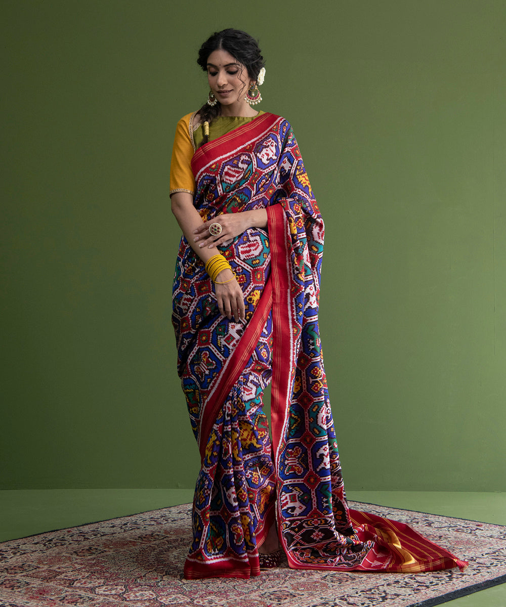 Blue_And_Red_Handloom_Weft_Dyed_Patola_Saree_With_8_Ply_Mulberry_Silk_And_Animal_Motifs_WeaverStory_01