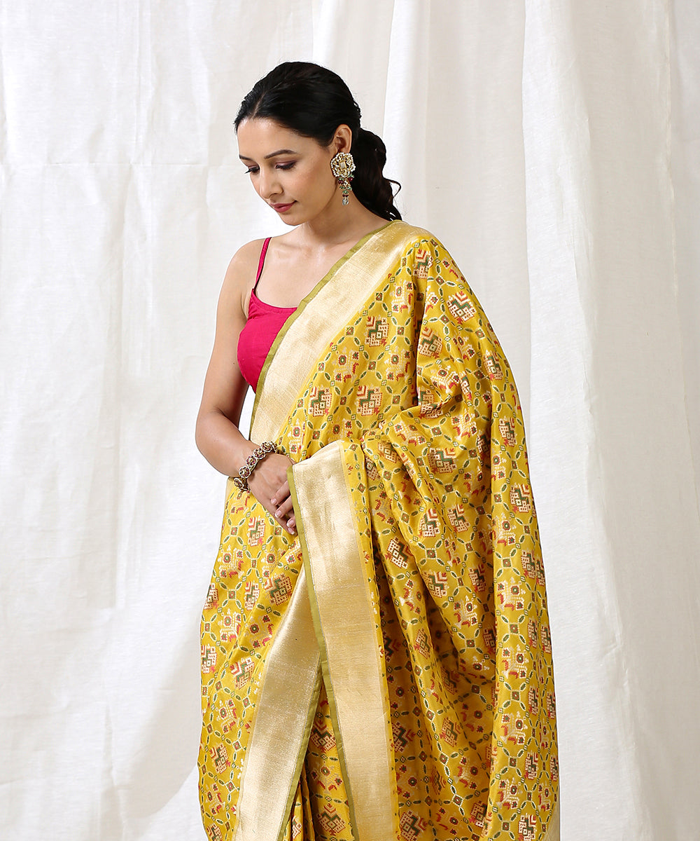 Yellow_Handloom_Pure_Katan_Silk_Patola_Saree_With_Zari_Border_WeaverStory_01