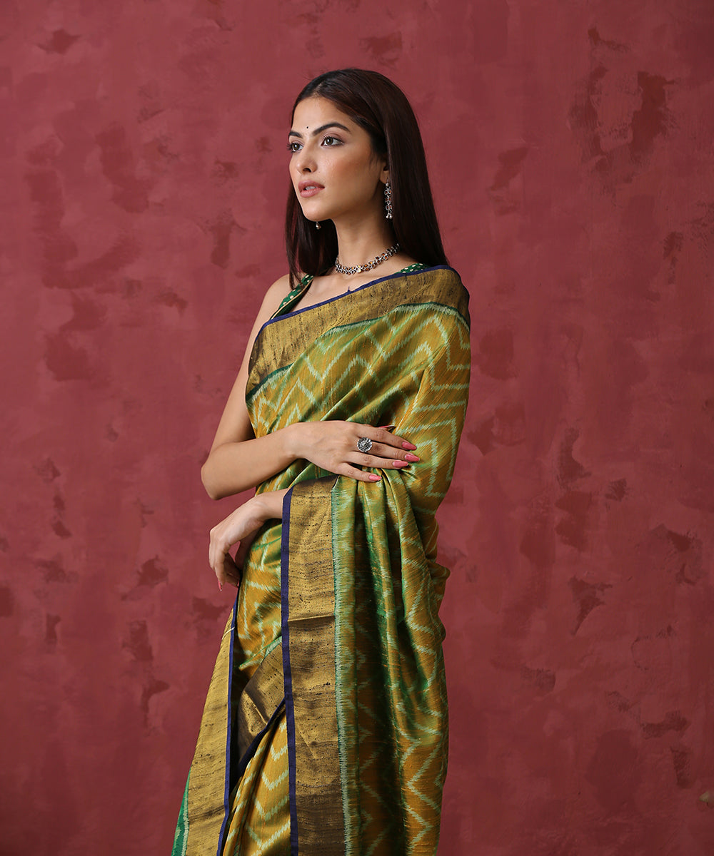 Handloom_Mustard_and_Green_Raw_Silk_Patola_Saree_With_Gold_Border_And_Green_Pallu_WeaverStory_01